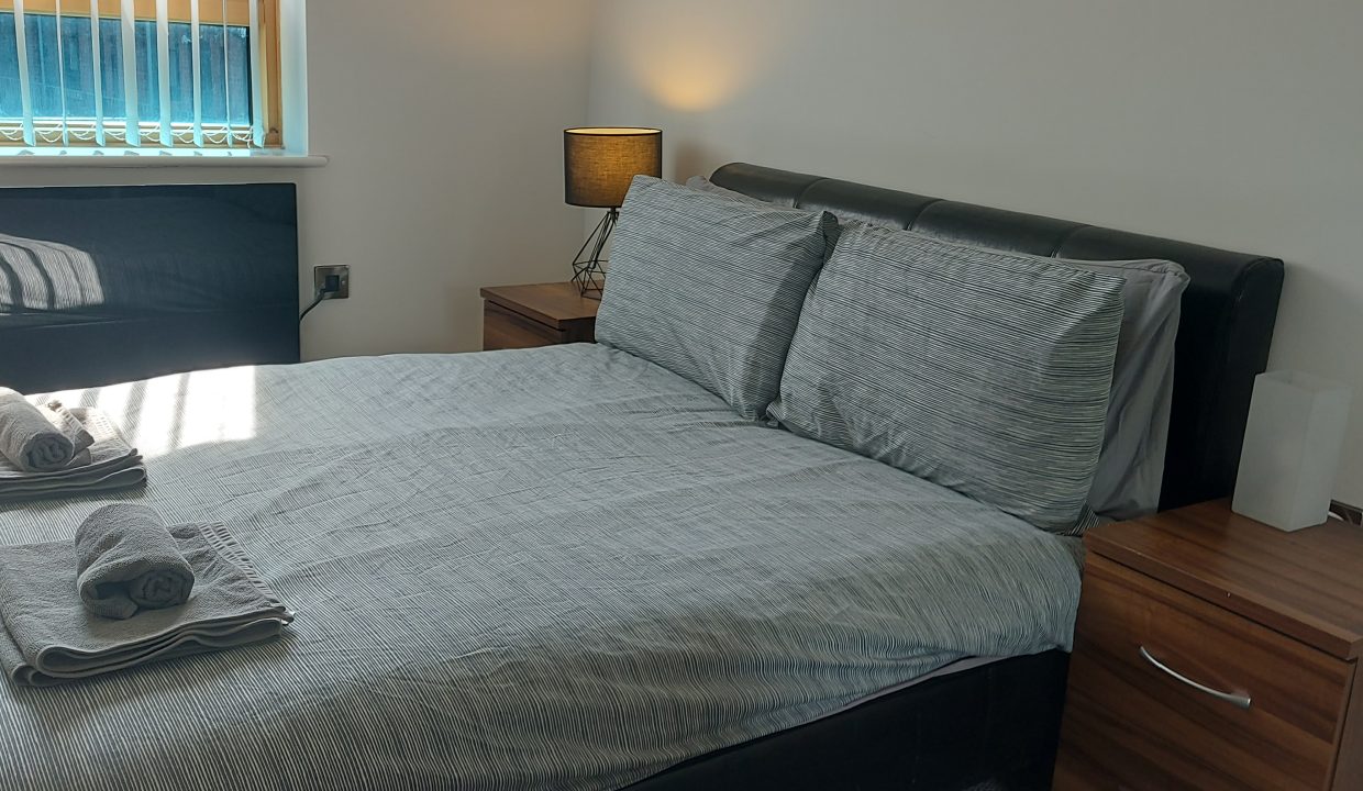 bedroom 2 with bedside cupboard