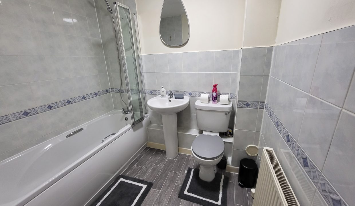 another photo of bathroom and a tub'